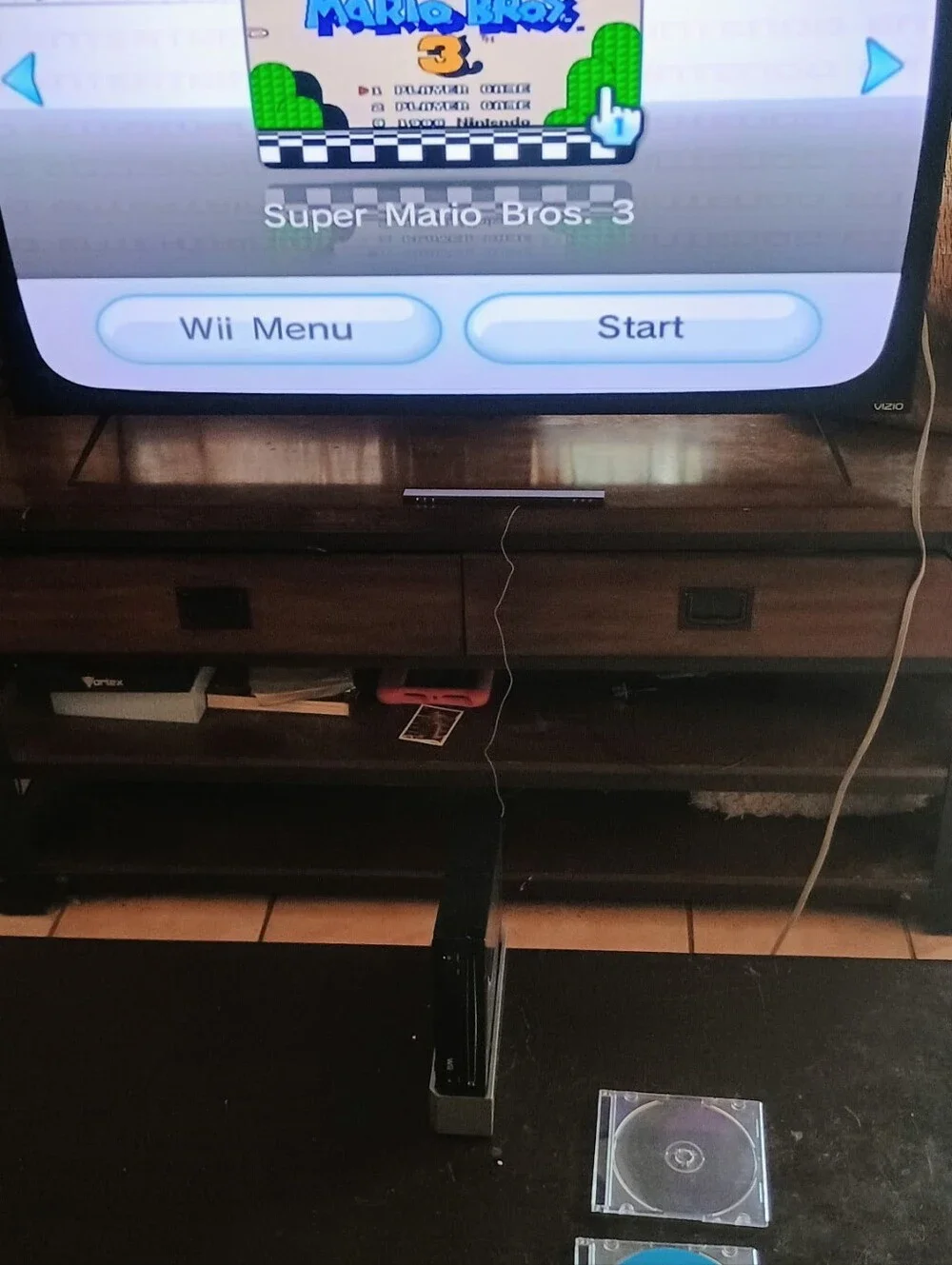 Nintendo Wii Bundle with 4 Games Black Console and White Controllers